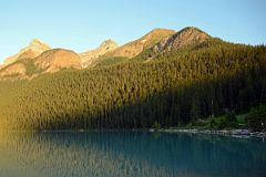 01 Lake Agnes Trail Contours Through The Trees To The Lake Just To The Right Of The Big Beehive With Mount Whyte, Mount Niblock and Mount St Piran Early Morning